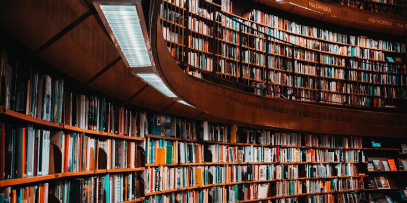 photo of brown wooden bookshelf